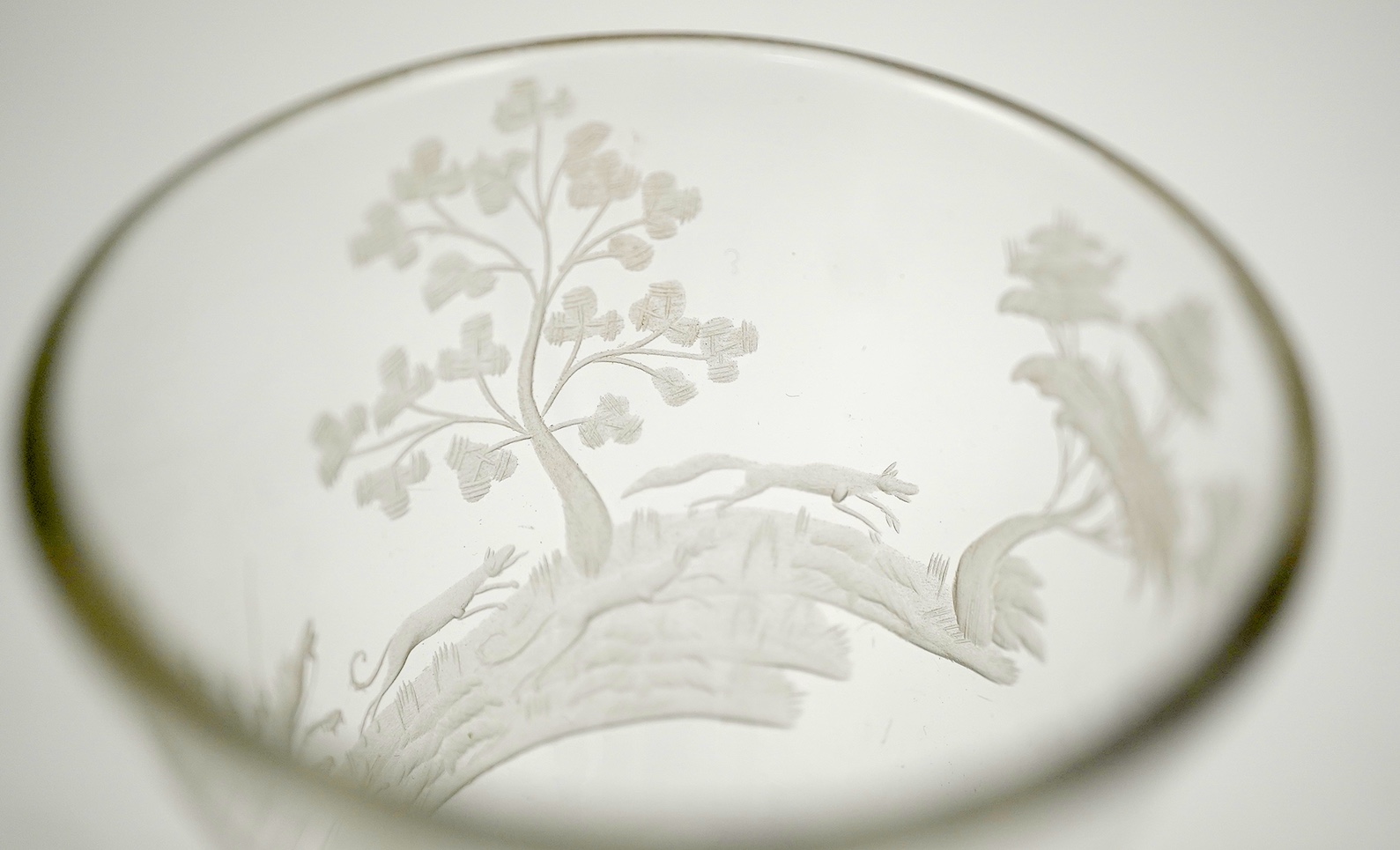 Two faceted wine glasses, engraved with hunting scenes, c.1780